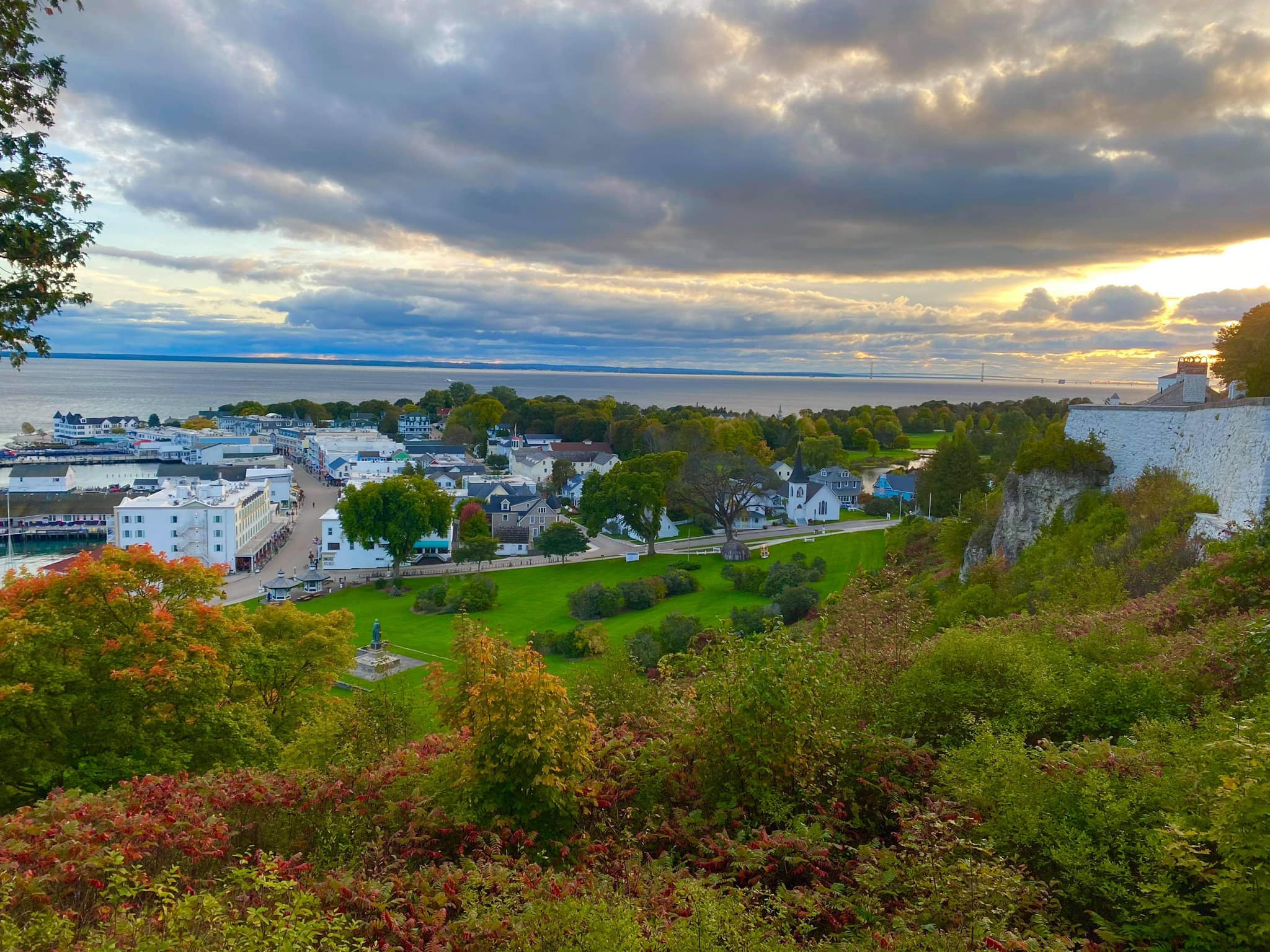 view of mackinac island and main street from atop a hill on mackinac island