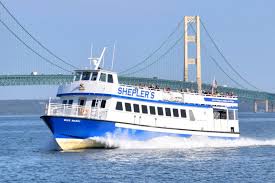 Star Line ferry under mackinac bridge headed to the island